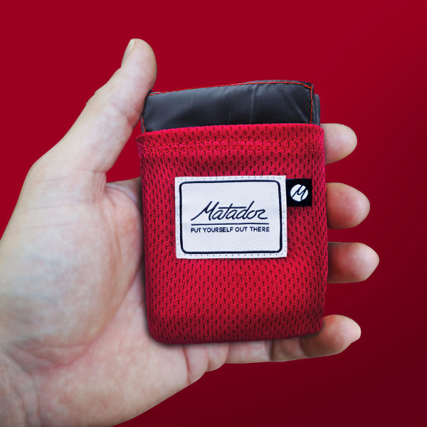 Matador pocket blanket 2.0 in hand